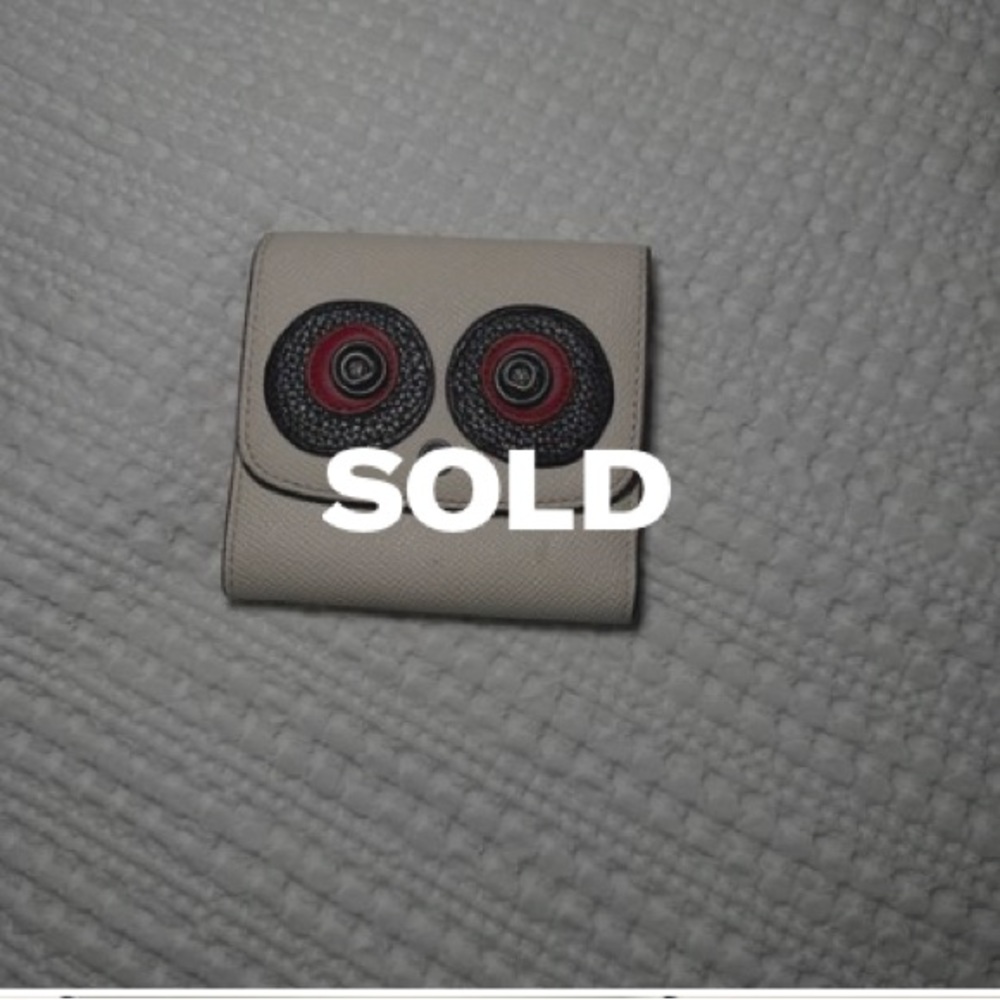 Coach leather wallet. Can expand to fit cash and many cards.